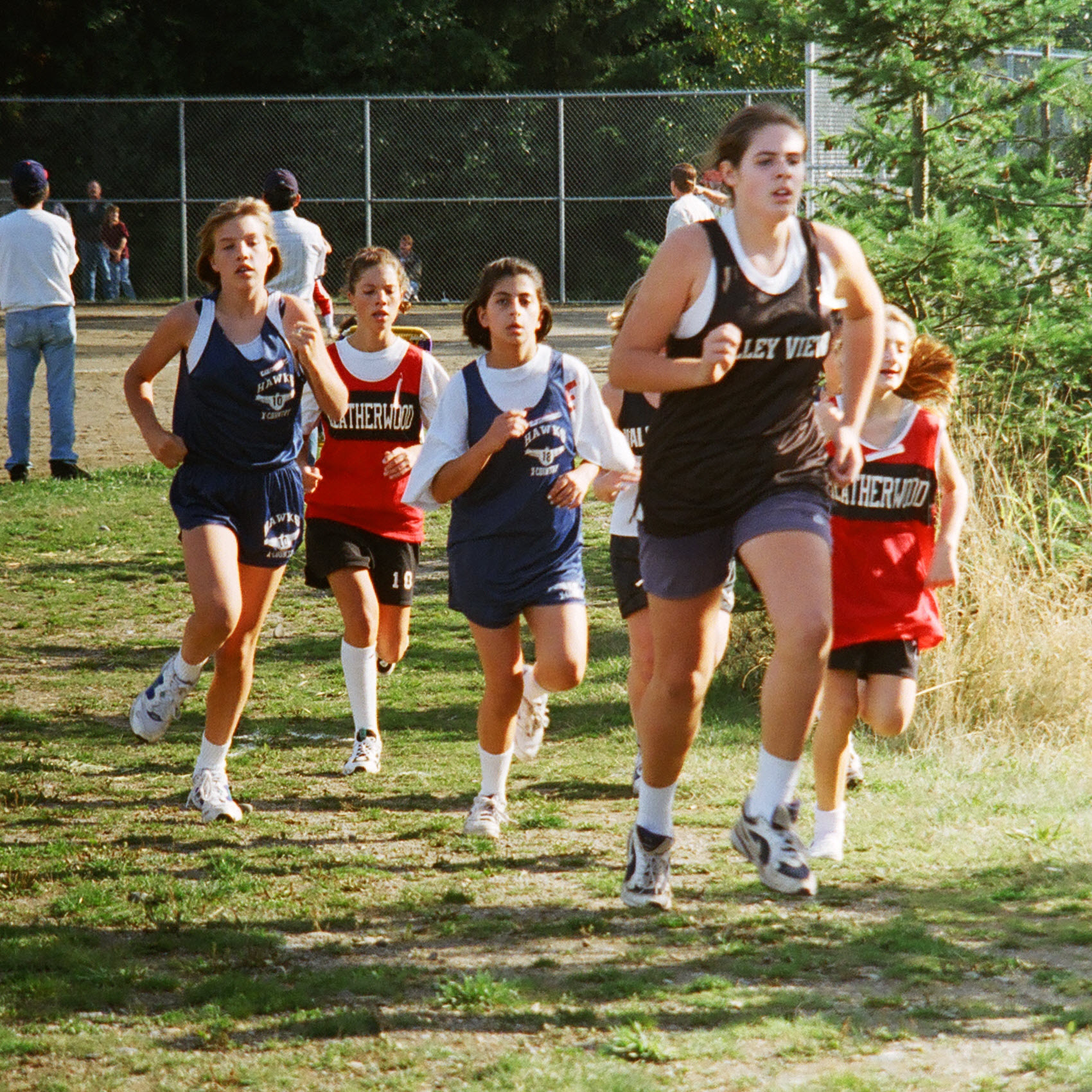 Erika running cross country for Harbour Pointe Middle School.