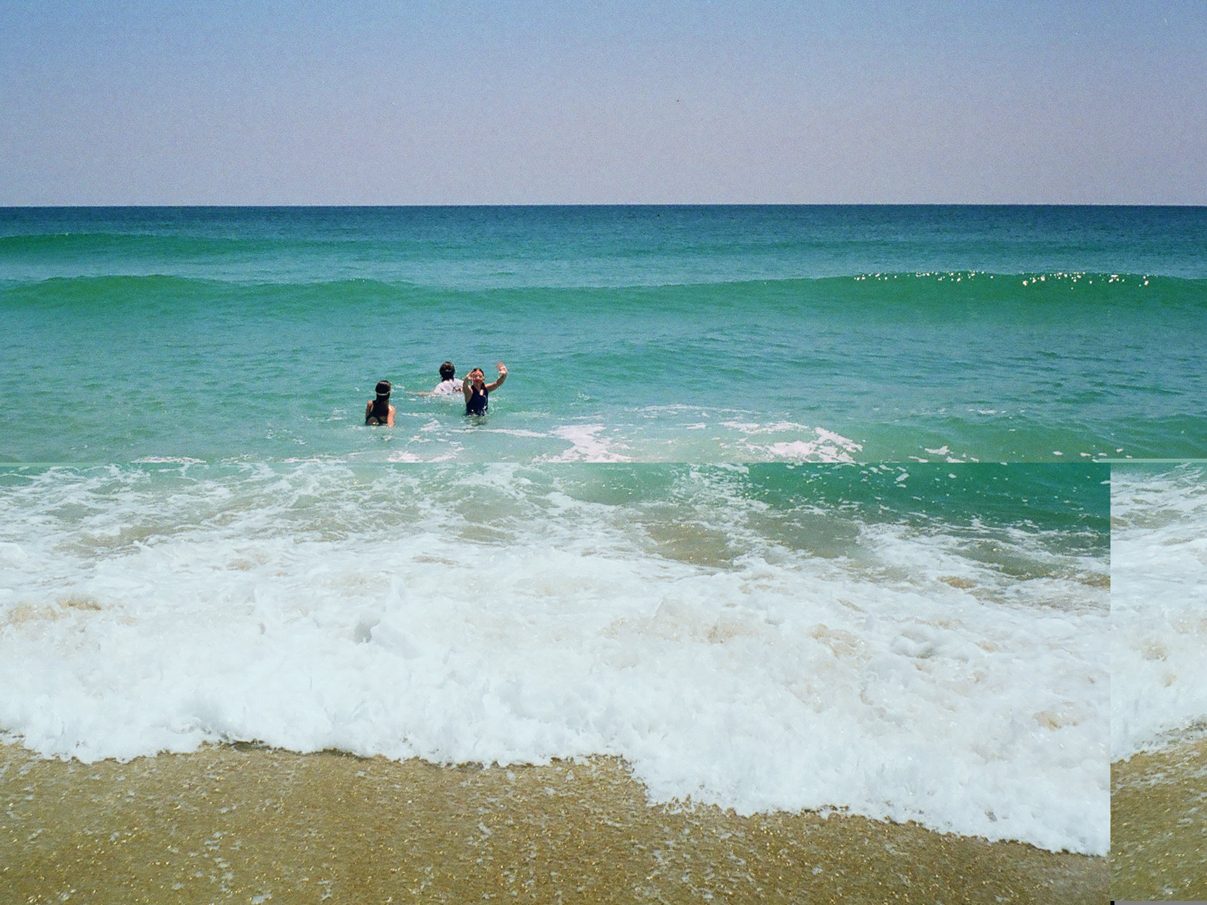 Playing in the warm Atlantic Ocean surf.