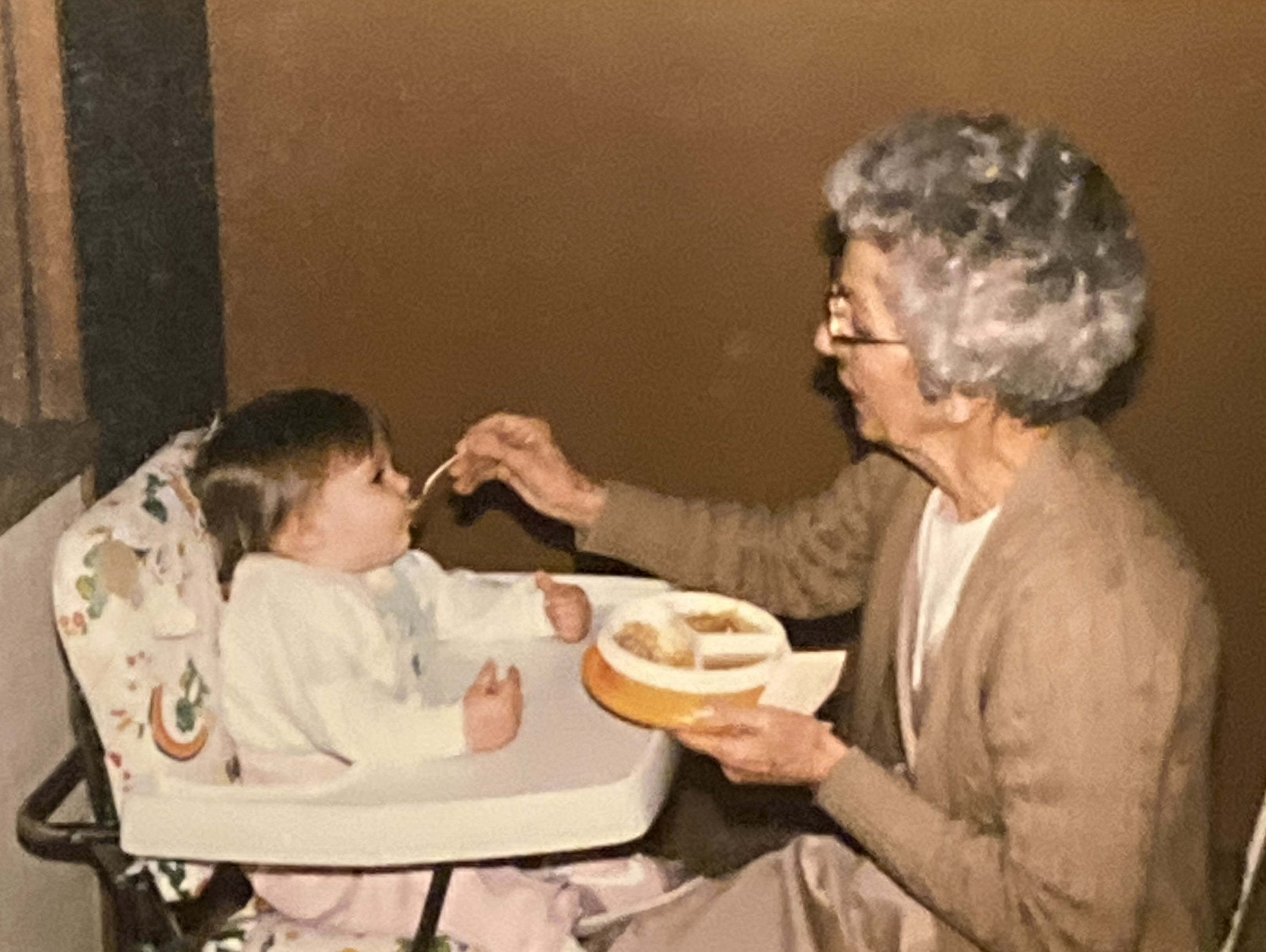 Grandma Agnes feeding Laura.