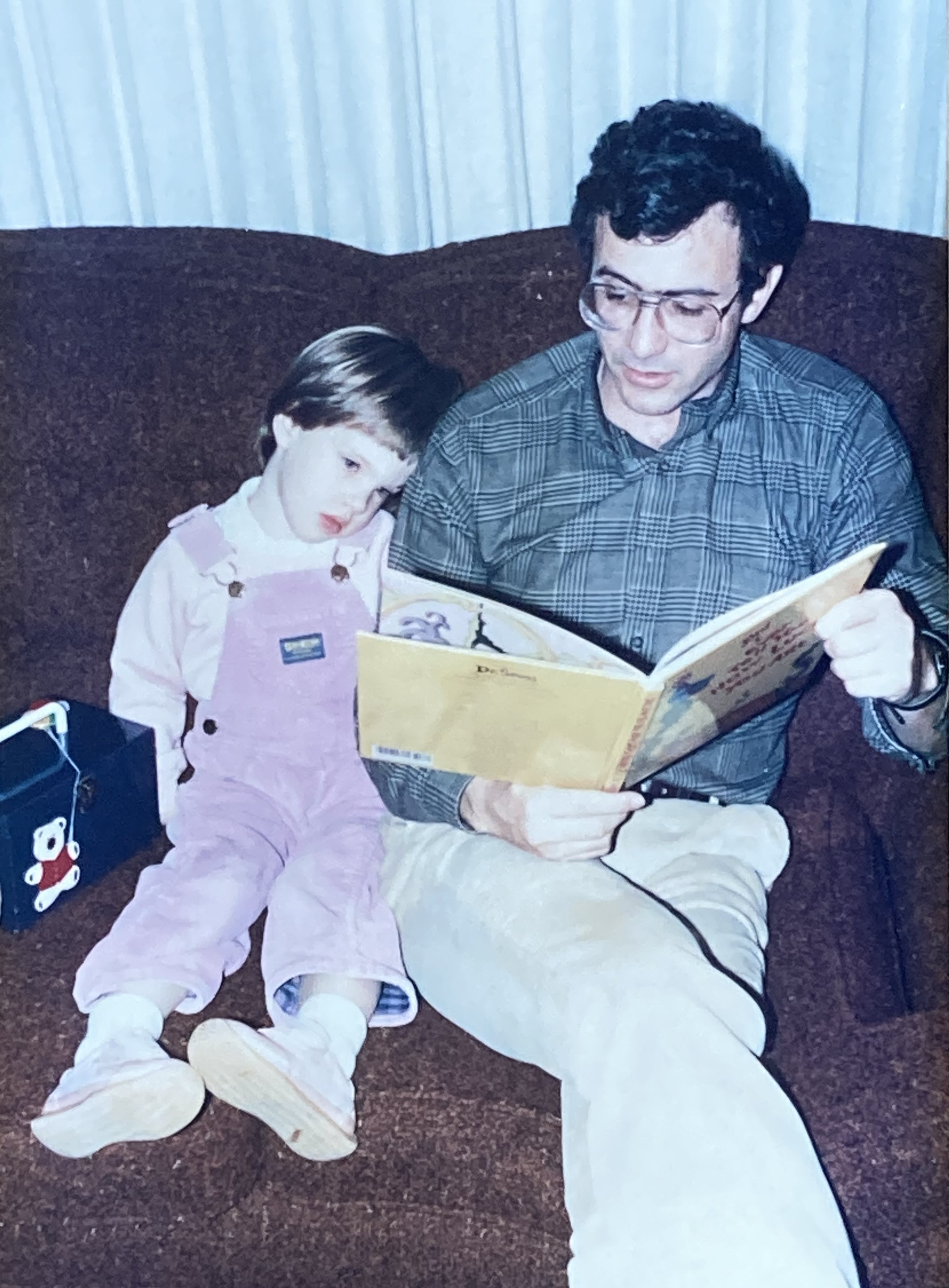 Doug Walker reading to Erika at hour house in Greenwood.