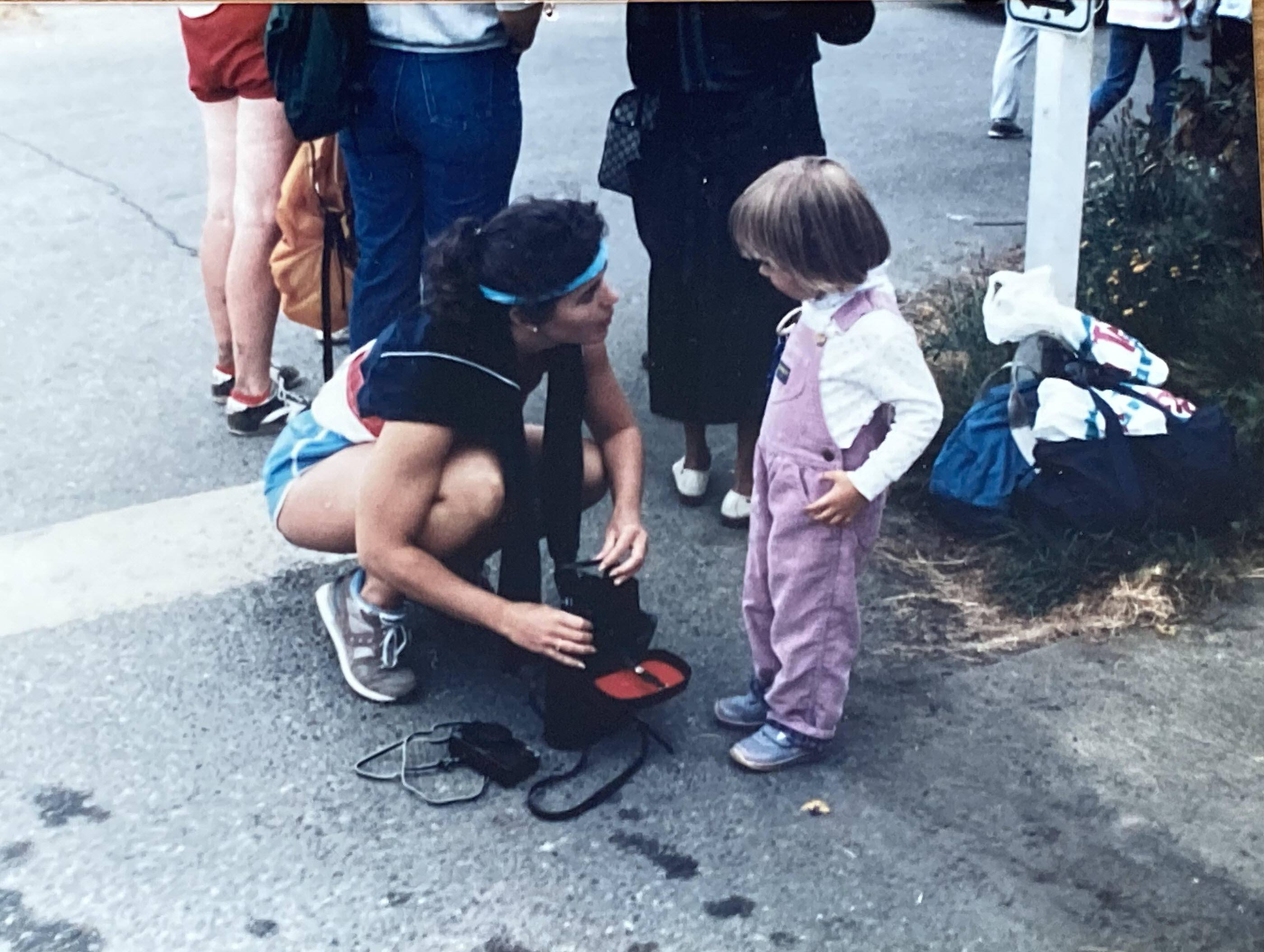 Lisa Immerwahr with Erika while preparing for her running leg in the Triplethon.