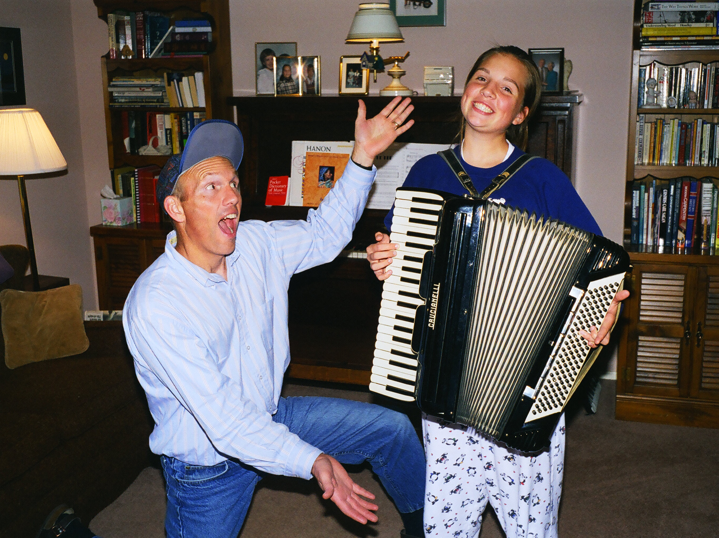 Laura tries the accordion.