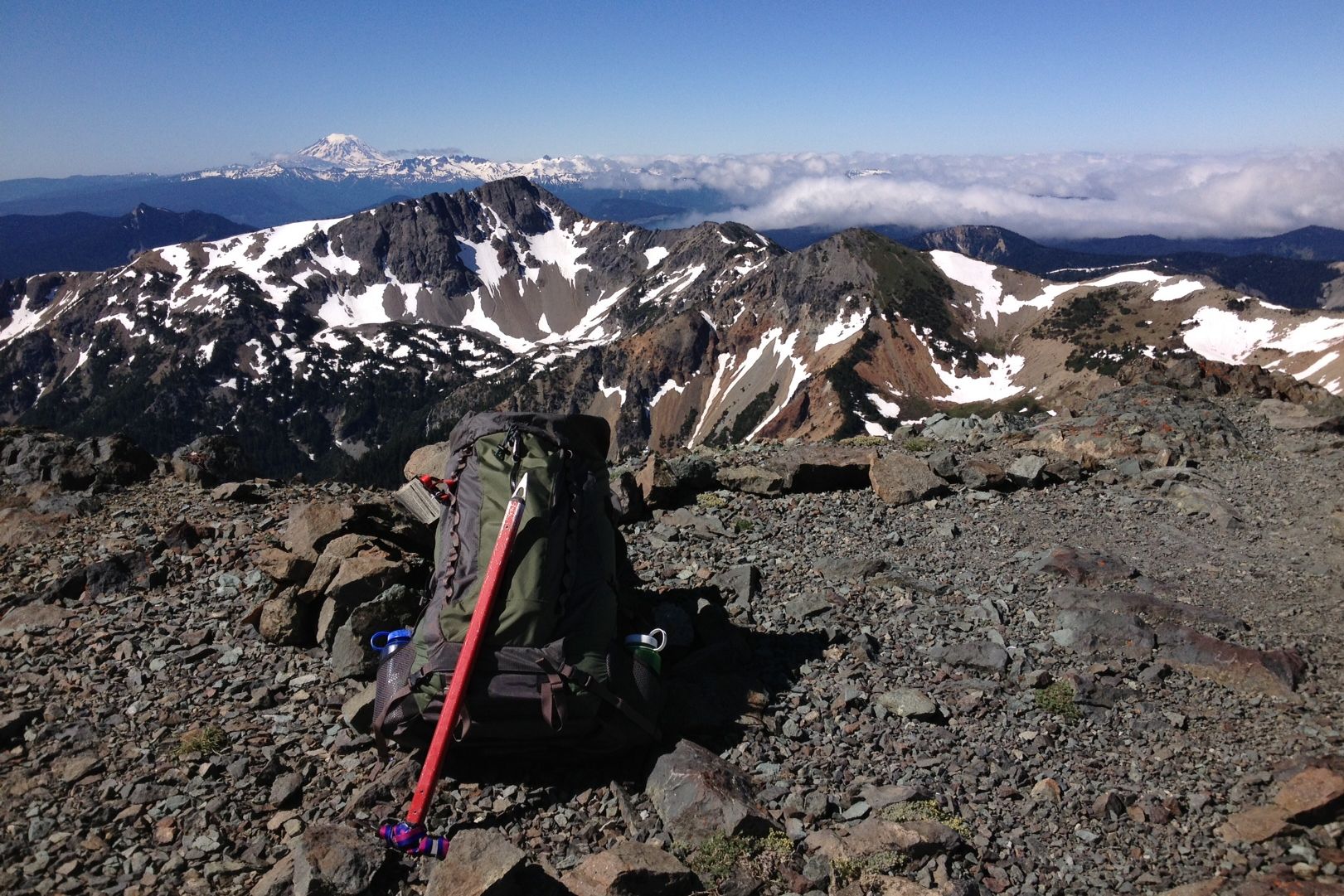 Mountain Goats just below and right of the summit of Bismarck Peak.