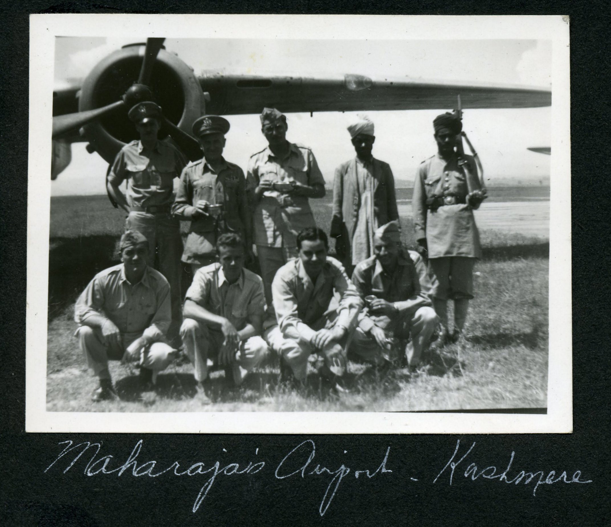 Tommy Thompson, front row, nearest the B-25