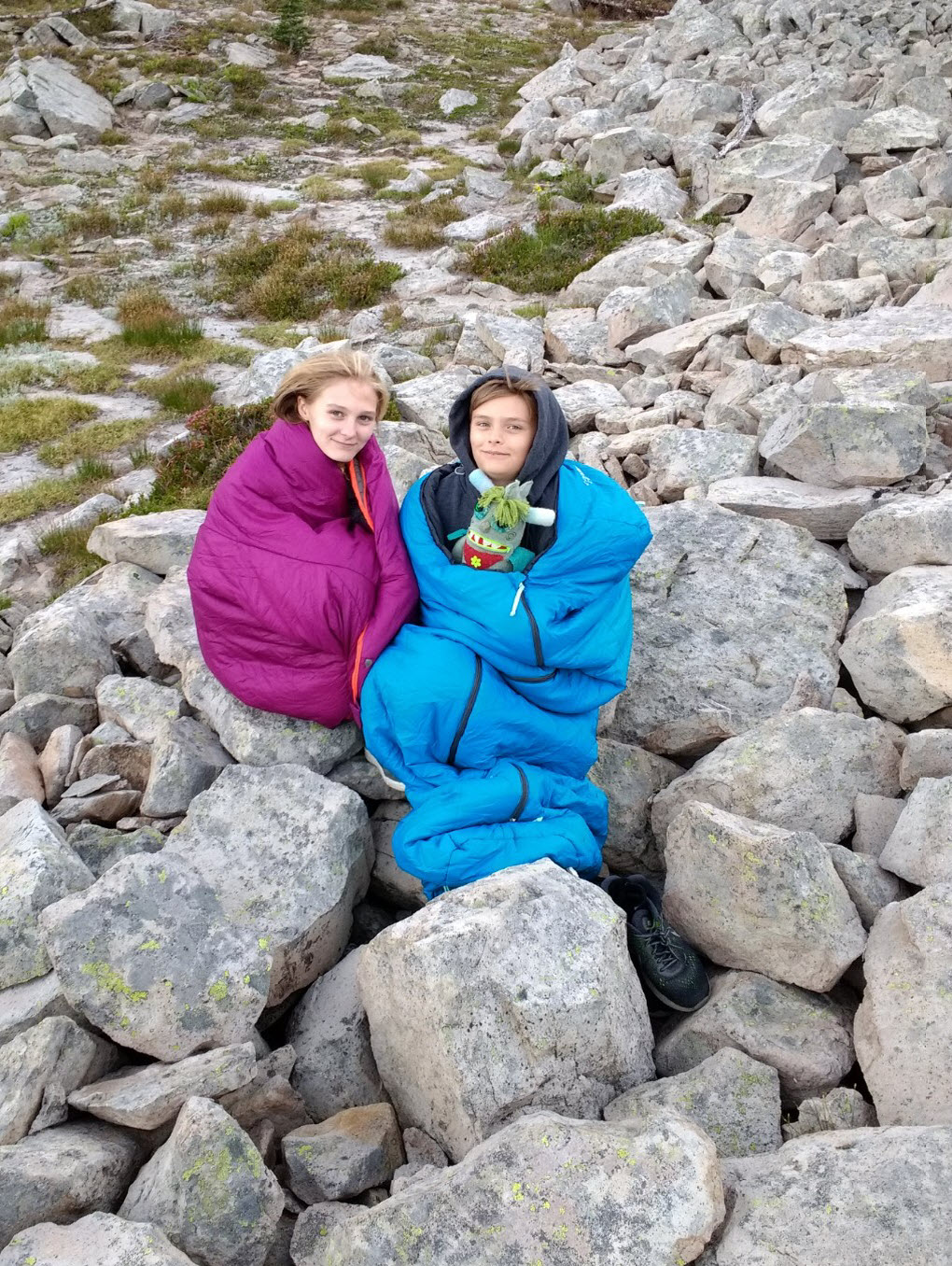 Ella and Sevy staying warm in their sleeping bags on Friday morning.